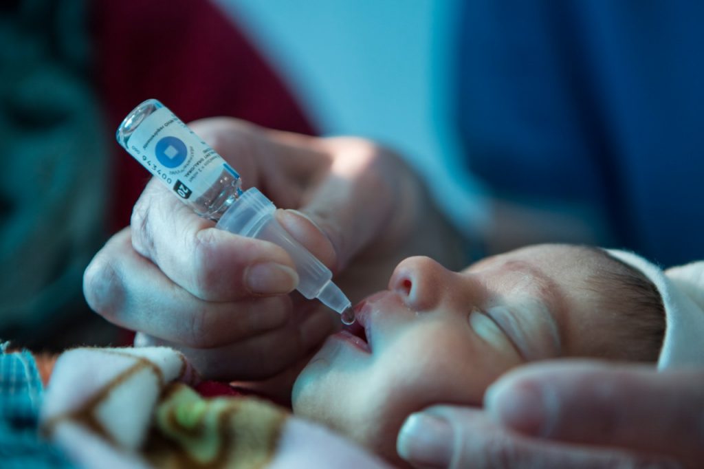 A baby is vaccinated at a UNICEF health center.