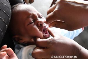 a child is getting a drop in his mouth