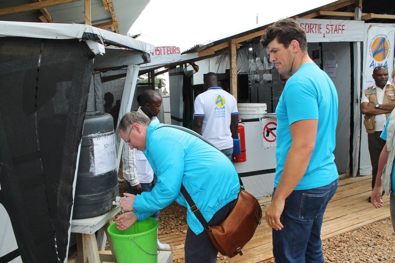 UNICEF Ambassador Donncha O'Callaghan and UNICEF's Gerard McDonnell visiting an Ebola Treatment Centre in the DRC