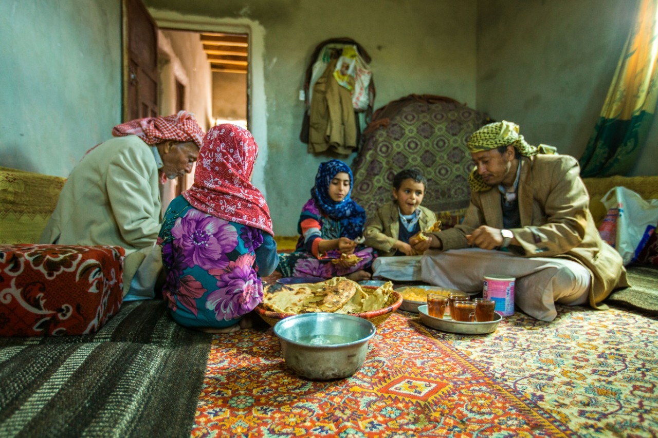 A family in Yemen share a meal. 