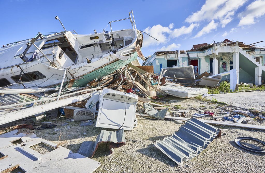 a house and a boat completely destroyed