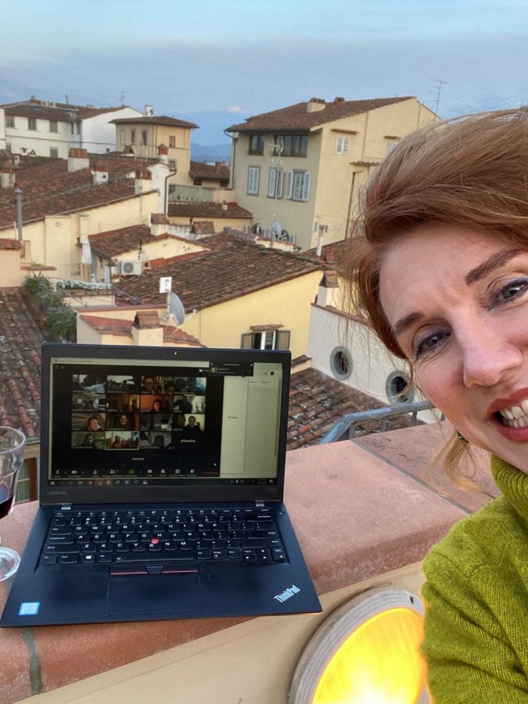 A woman is doing a virtual social event in Florence.