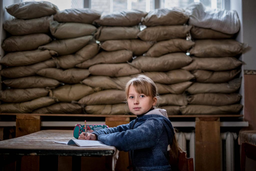 Ukraine Girl Sits at School Desk