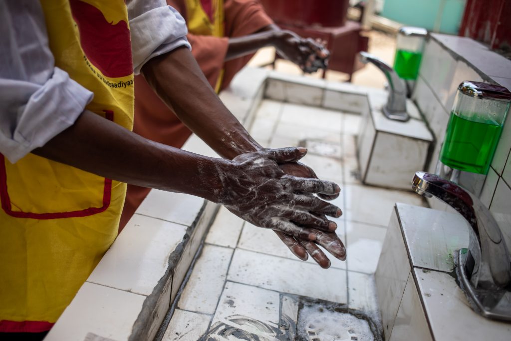 health workers wash hands