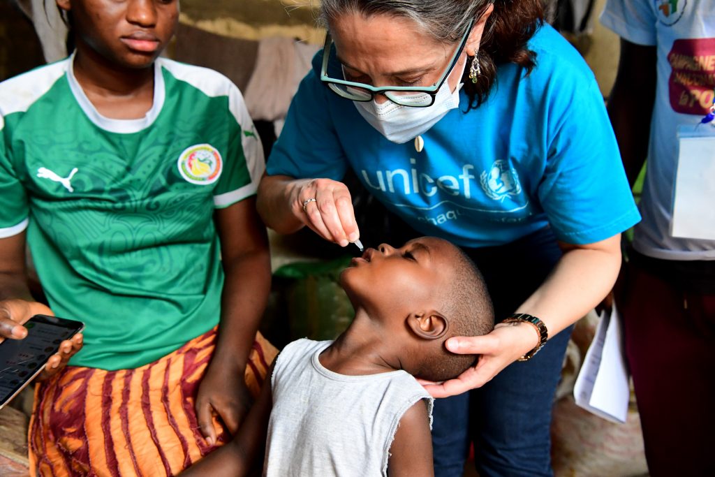 little boy receives polio vaccine