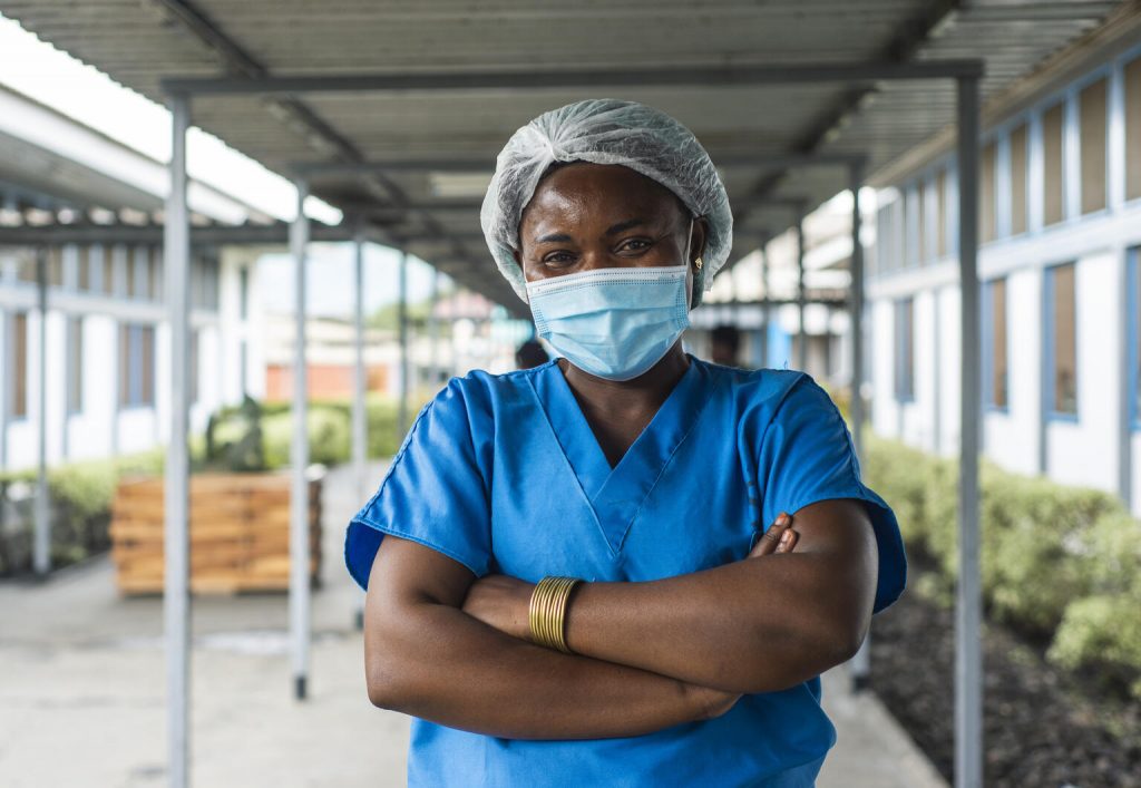 congolese nurse smiles at camera