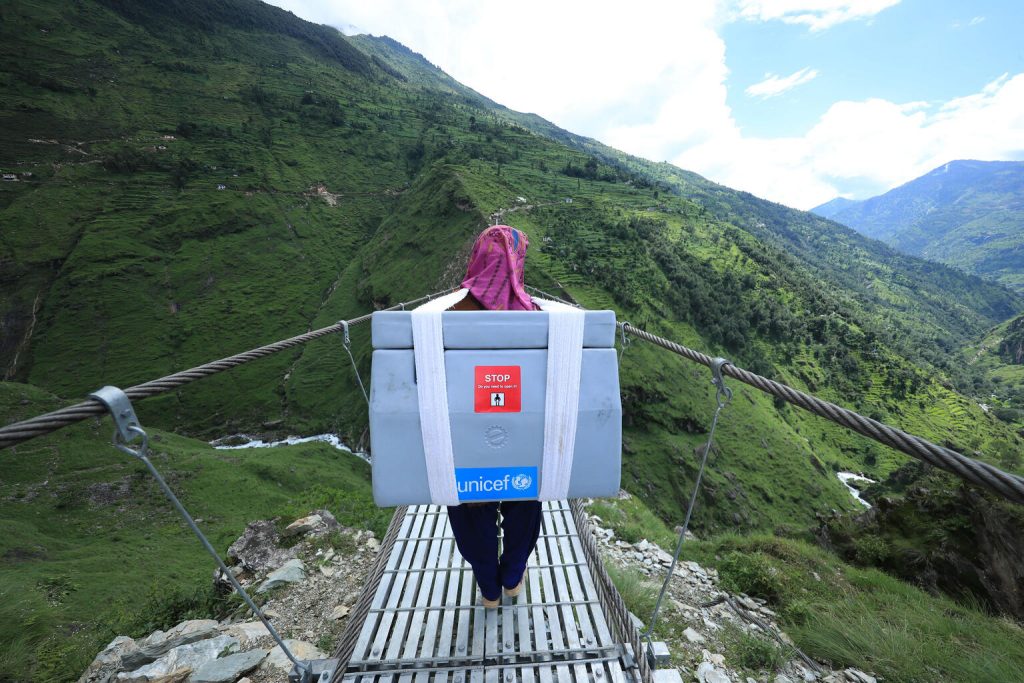 vaccine worker crosses bridge