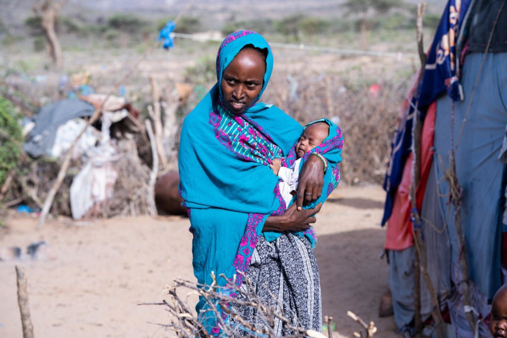 mother holds child