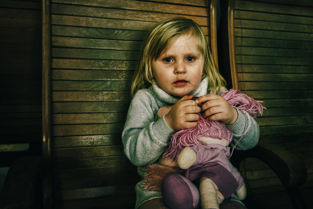 Milana in Ukraine holding her doll