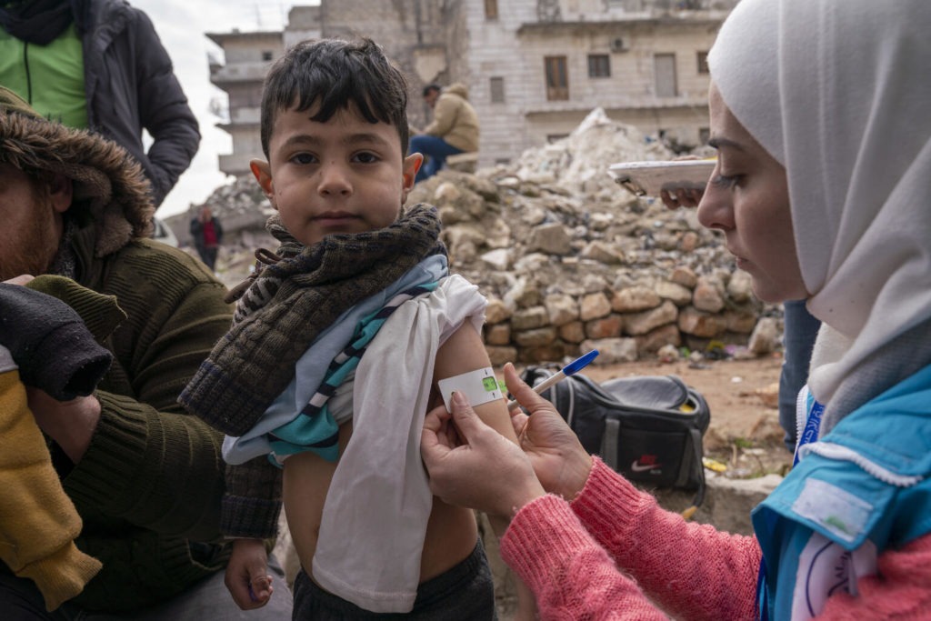 health worker checks child