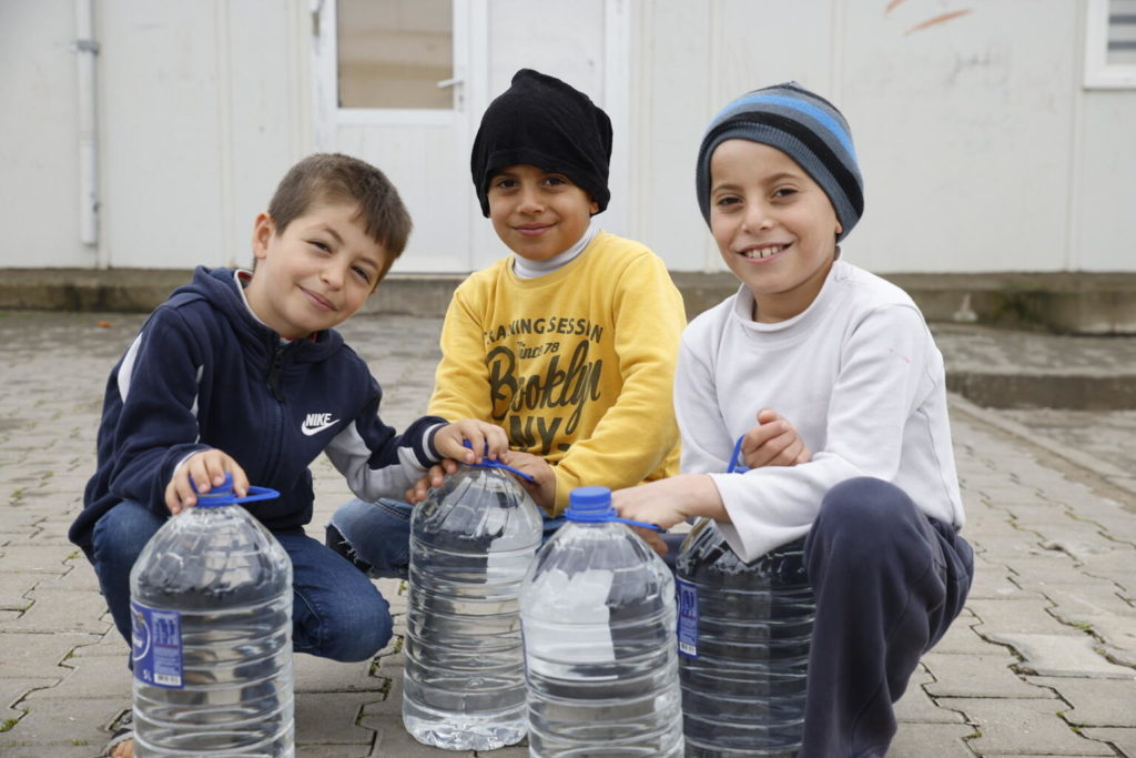 syrian children smile at camera