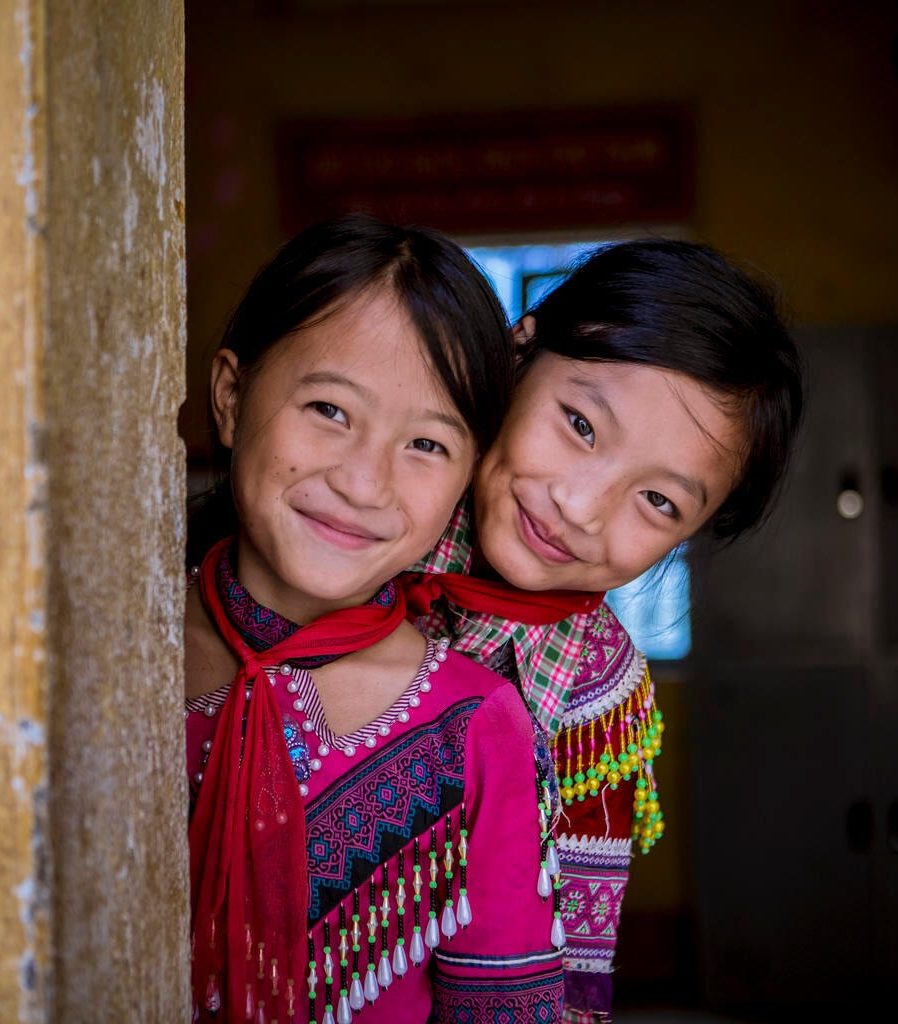 From left to right, Giang Thi Ly (class 4A), Ma Thi Do (class 4A) sharing room #4 at Sin Cheng semi boarding ethnic lower secondary school.