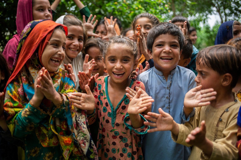Children play with each other in an Afghan refugee community on July 18, 2023 in, Swabi, Khyber Pakhtunkhwa, Pakistan.