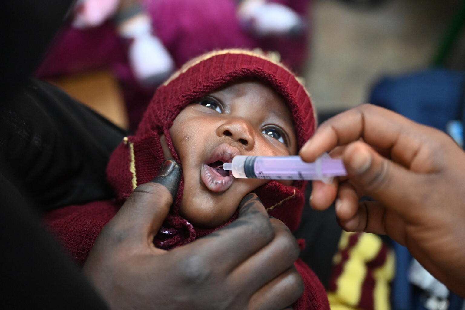 child receives oral vaccine