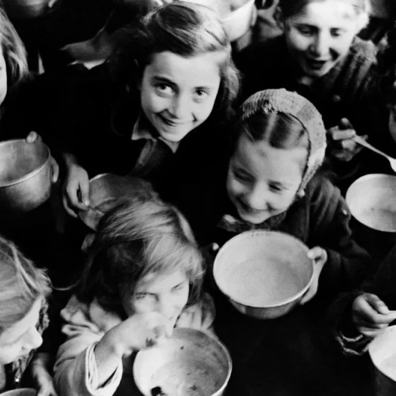 Greece, 1946: Children in Patras, a north-western port city, eat cereal provided by the United Nations Relief and Rehabilitation Administration.