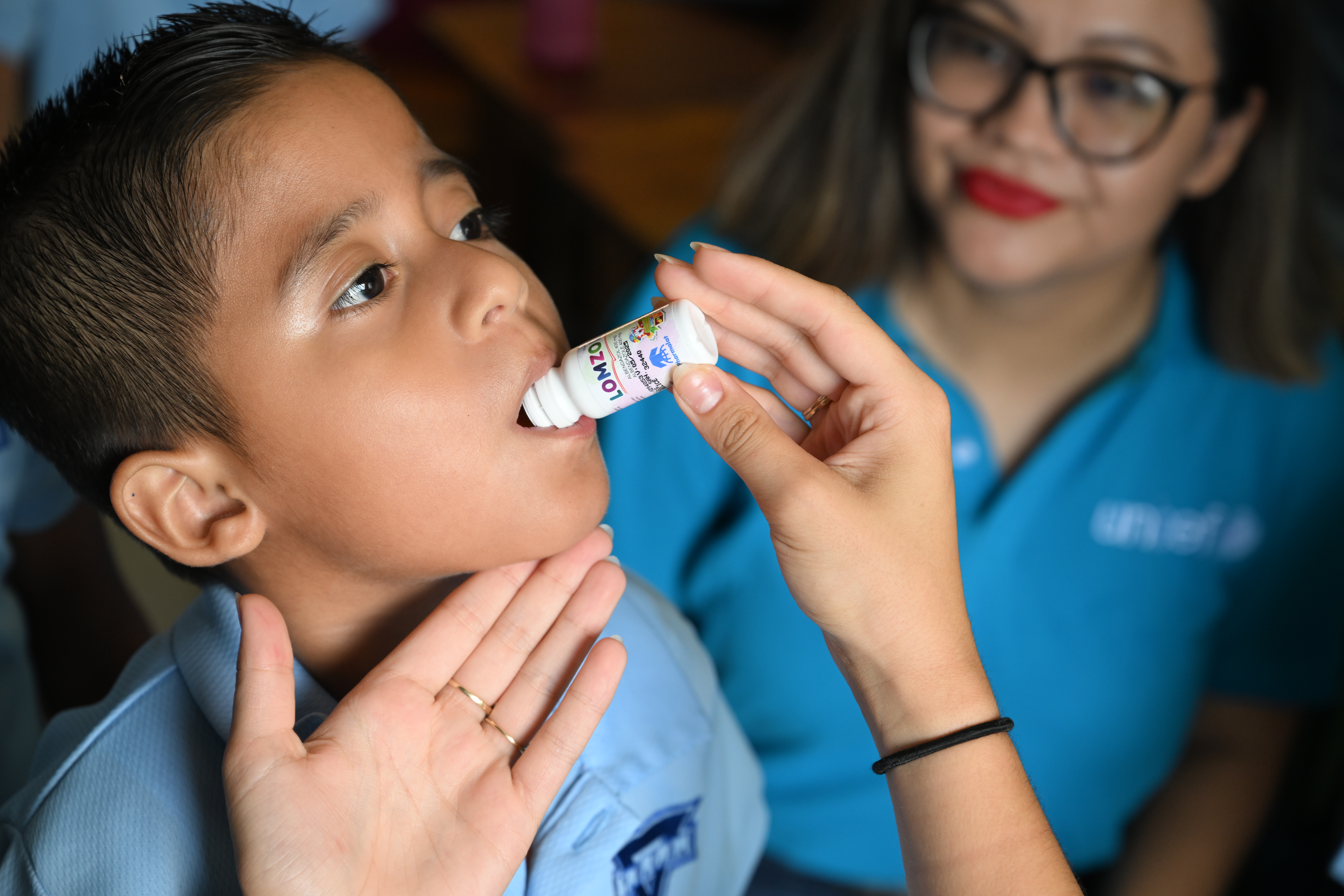 boy receives oral vaccine