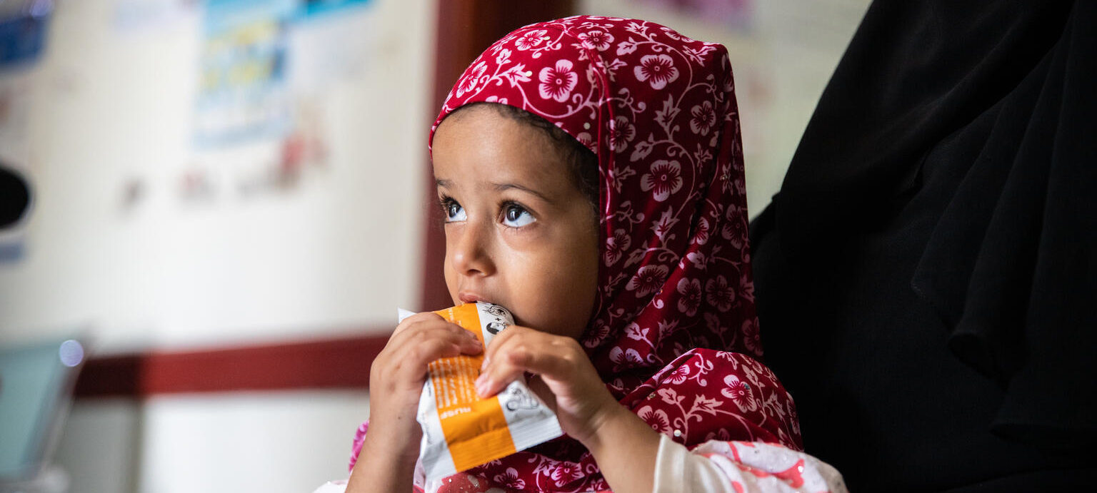 Farah eats some therapeutic food provided by UNICEF - Yemen.