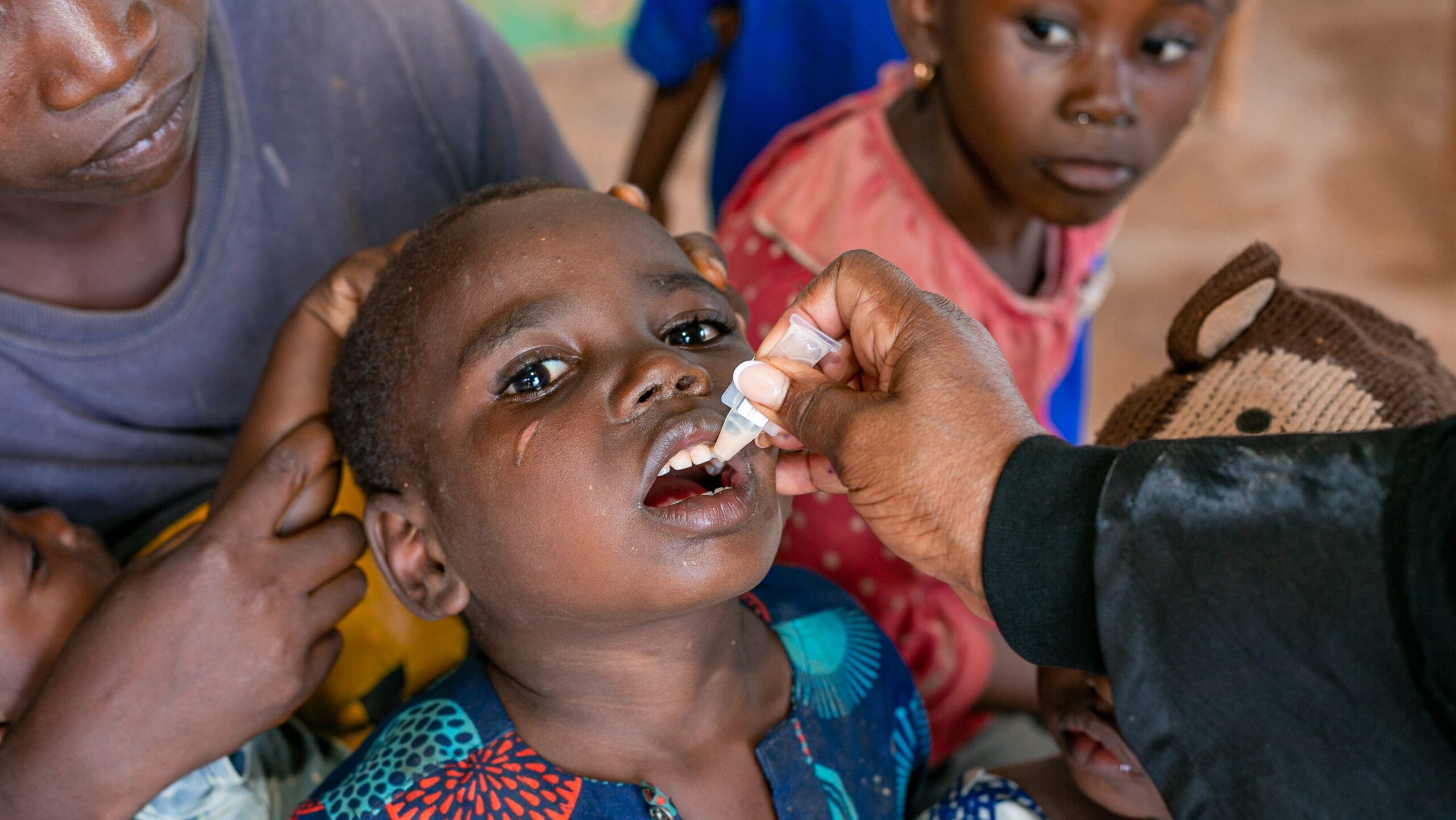 child receives oral vaccination