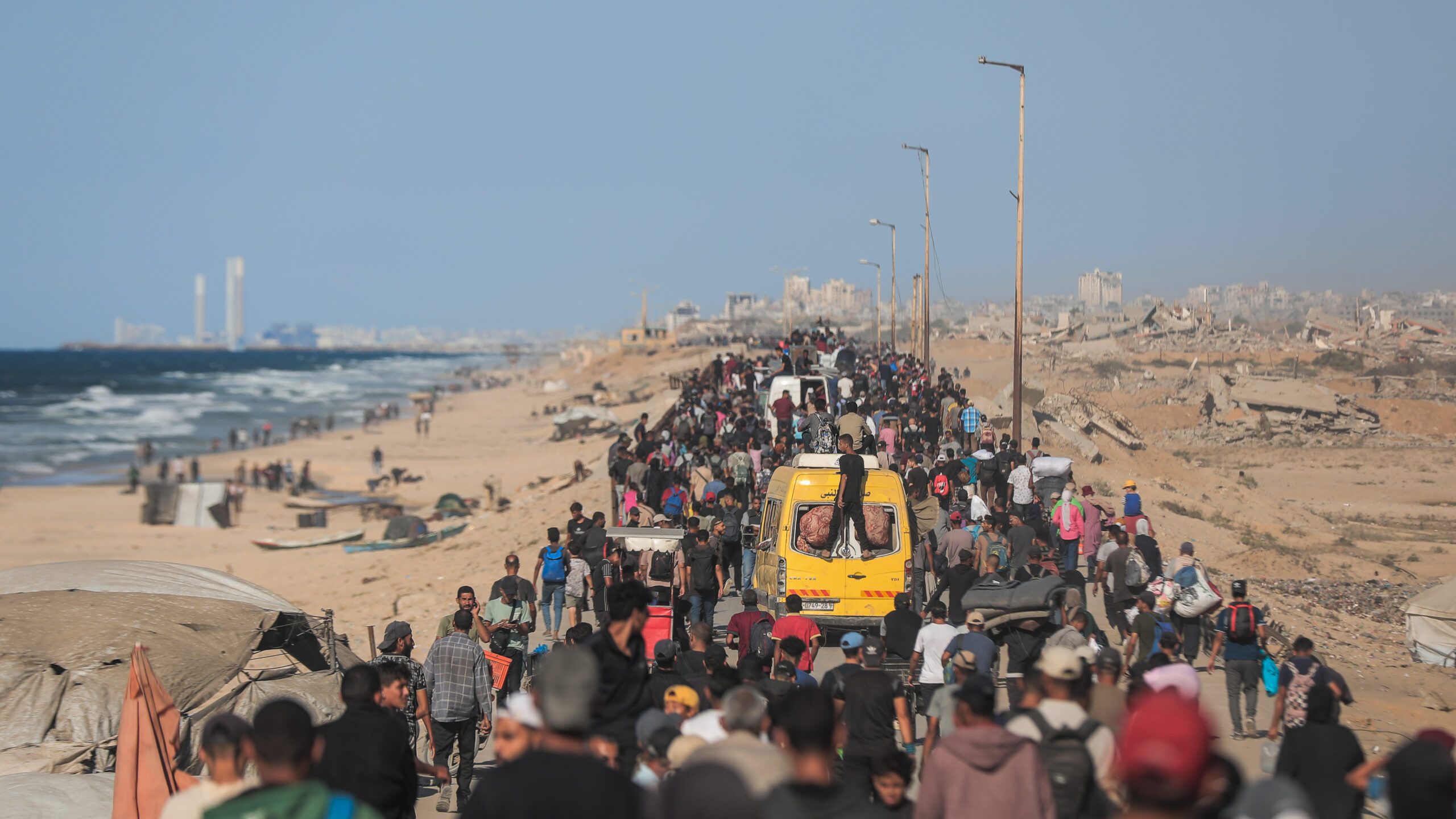 On 10 October 2025, thousands of Palestinian families are moving along the coastal road back to northern Gaza, amid the extreme devastation of infrastructure