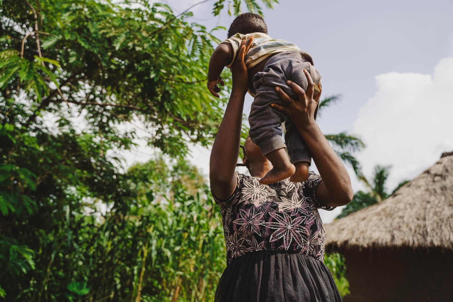 mother plays with  baby