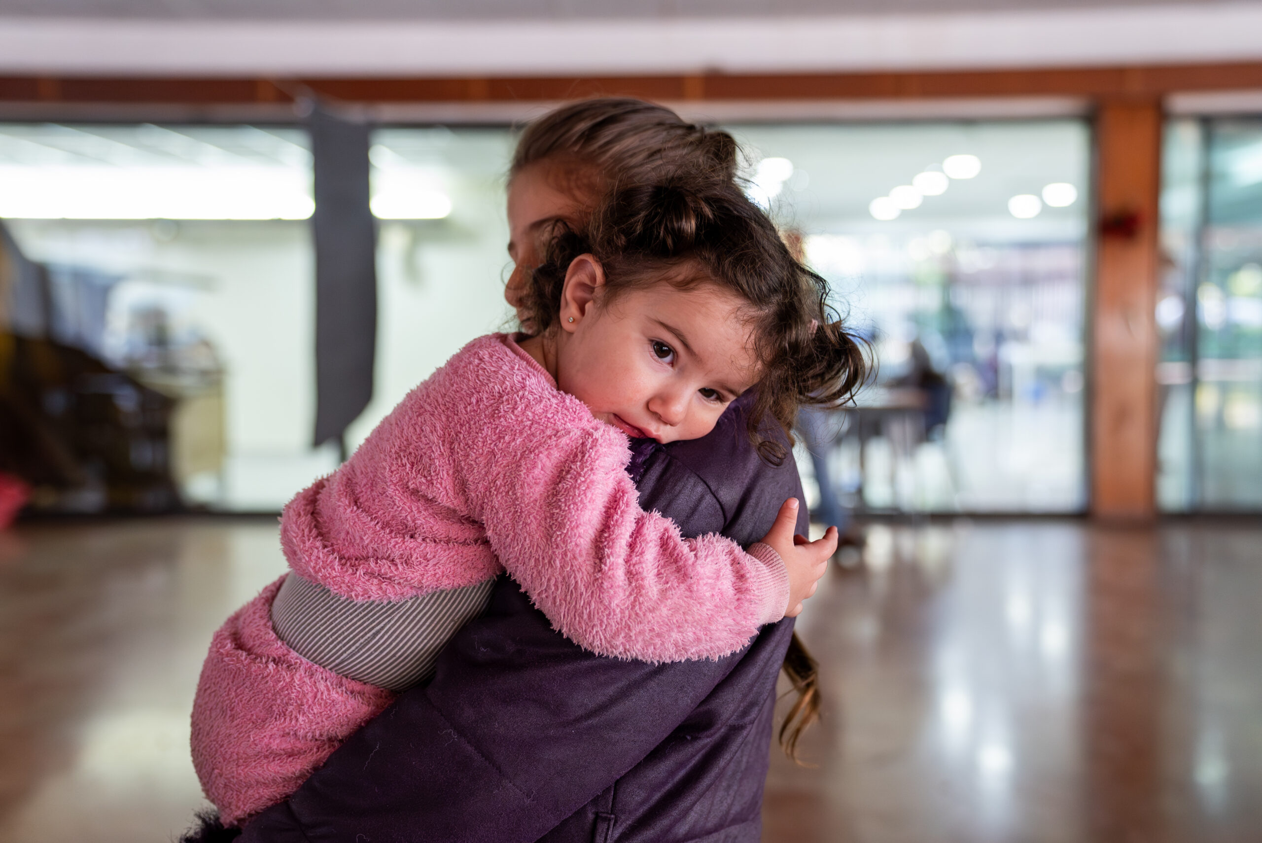 A young girl and her 10 years old sister stand in a public school turned into a shelter in Lebanon. The escalation in hostilities pushed many families to leave their homes.