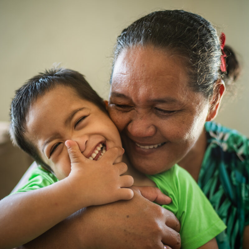 In Tuvalu, Vanessa and her son Enoch, who has a disability, receive help from a UNICEF programme. 