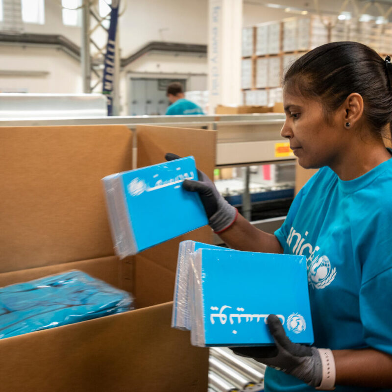 UNICEF staff pack Boxies with education supplies that will be sent on their journey to children thanks to people like you. 