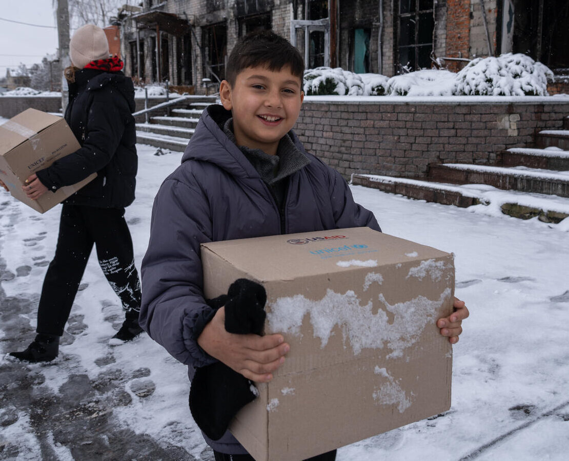 A child holding a box