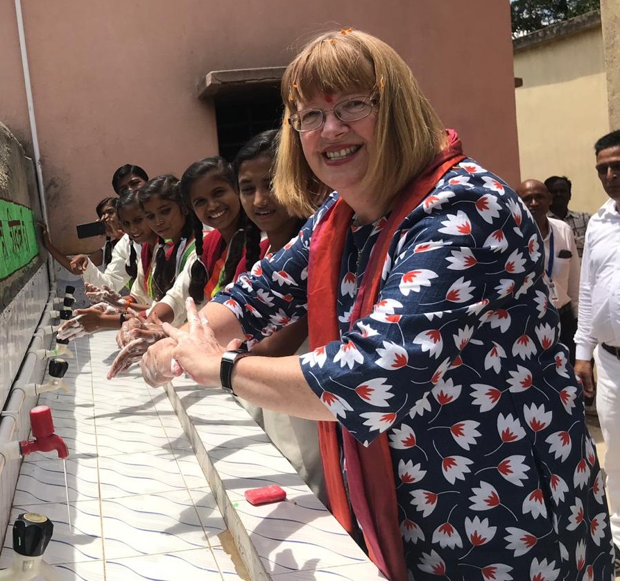 Therese Dooley washing her hands - Therese has seen first-hand how donations to UNICEF help children.